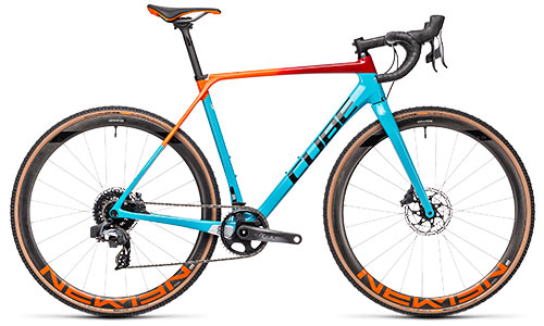 Bicicleta de carretera Cube Cyclocross en color turquesa con tubo superior rojo y naranja.