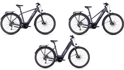 Se pueden ver tres bicicletas eléctricas Cube Touring Hybrid ONE de color gris, cada una con un cuadro diamante, un cuadro trapezoidal y un cuadro de entrada baja